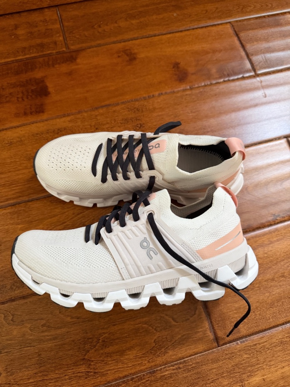 On Running Women's Sneakers in Cream with Pink Accents and Black Laces